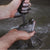 hands pouring graphite